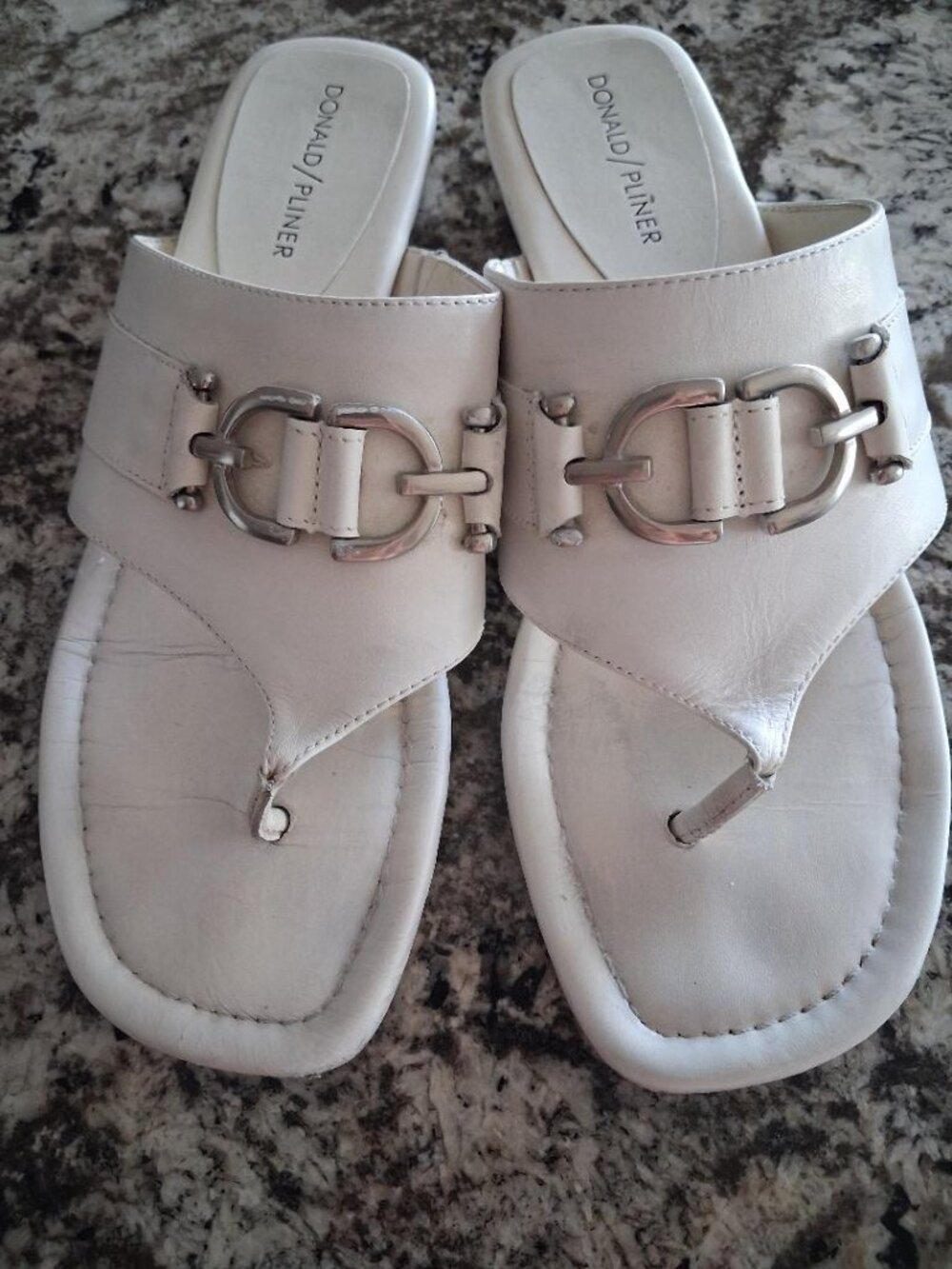 Donald Pliner "Kent" white slide sandals in size 8.5B w/silver buckle